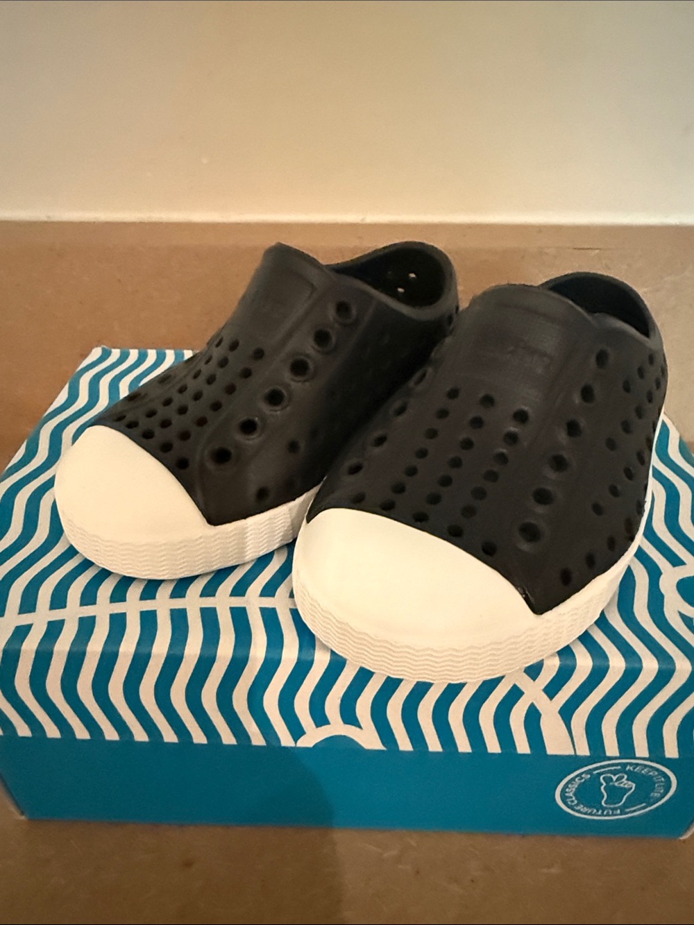 Native Shoes Black Slip-On Water Shoes with White Toe Cap